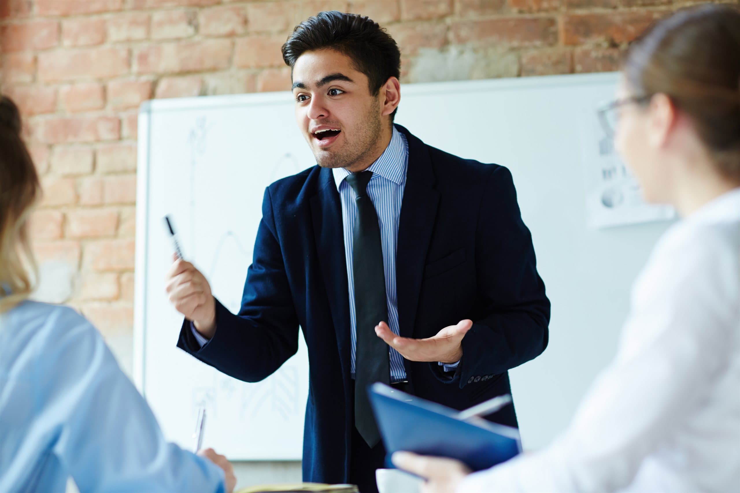 An intern presenting to his team