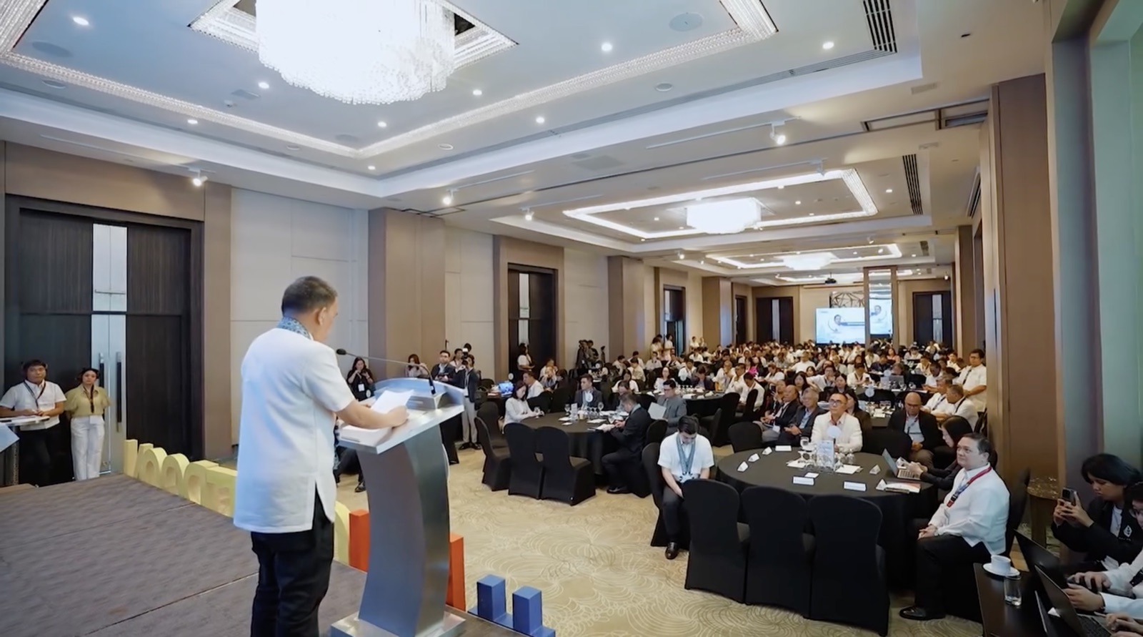 A speaker addresses a full plenary hall at Philippine CyberCon 2026, Sheraton Manila Bay